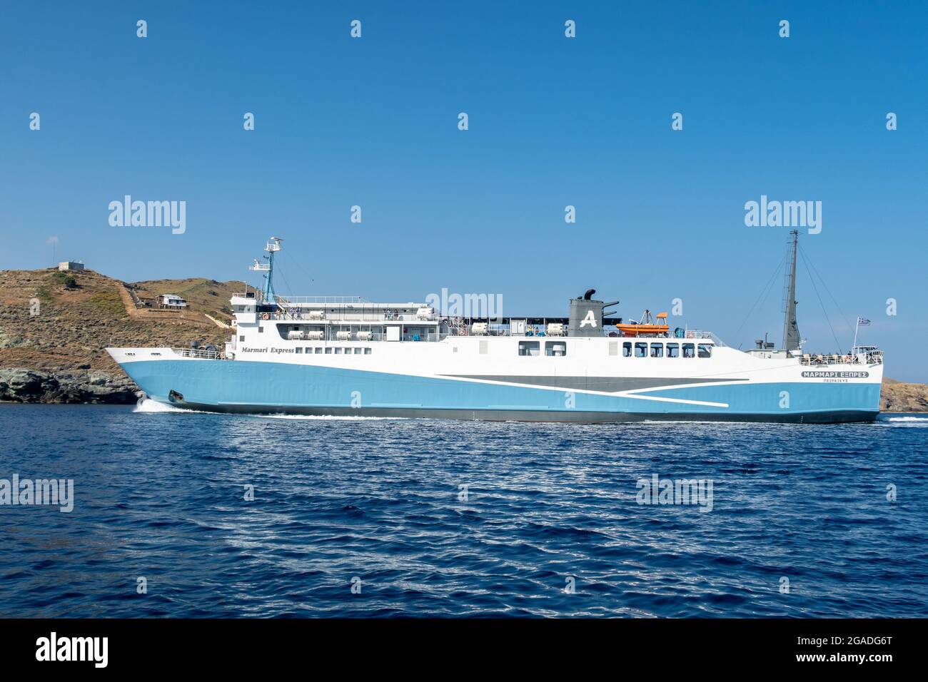 CORESSIA, Kea, Greece, 05.06.2019. Marmari Express big blue ferry ship enterning port in Coressia on Kea Island, Cyclades, Greece. Stock Photo