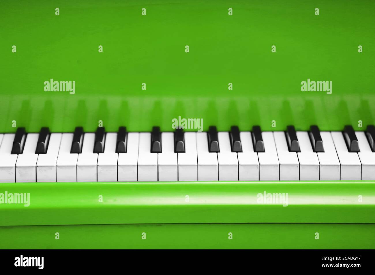 Piano keys of green piano close up Stock Photo - Alamy