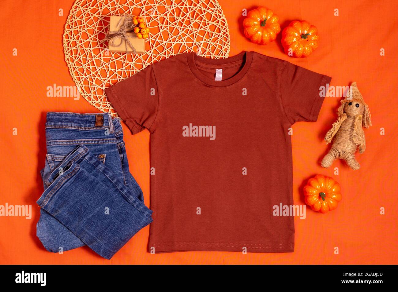 Brown t-shirt mockup on orange halloween background Stock Photo