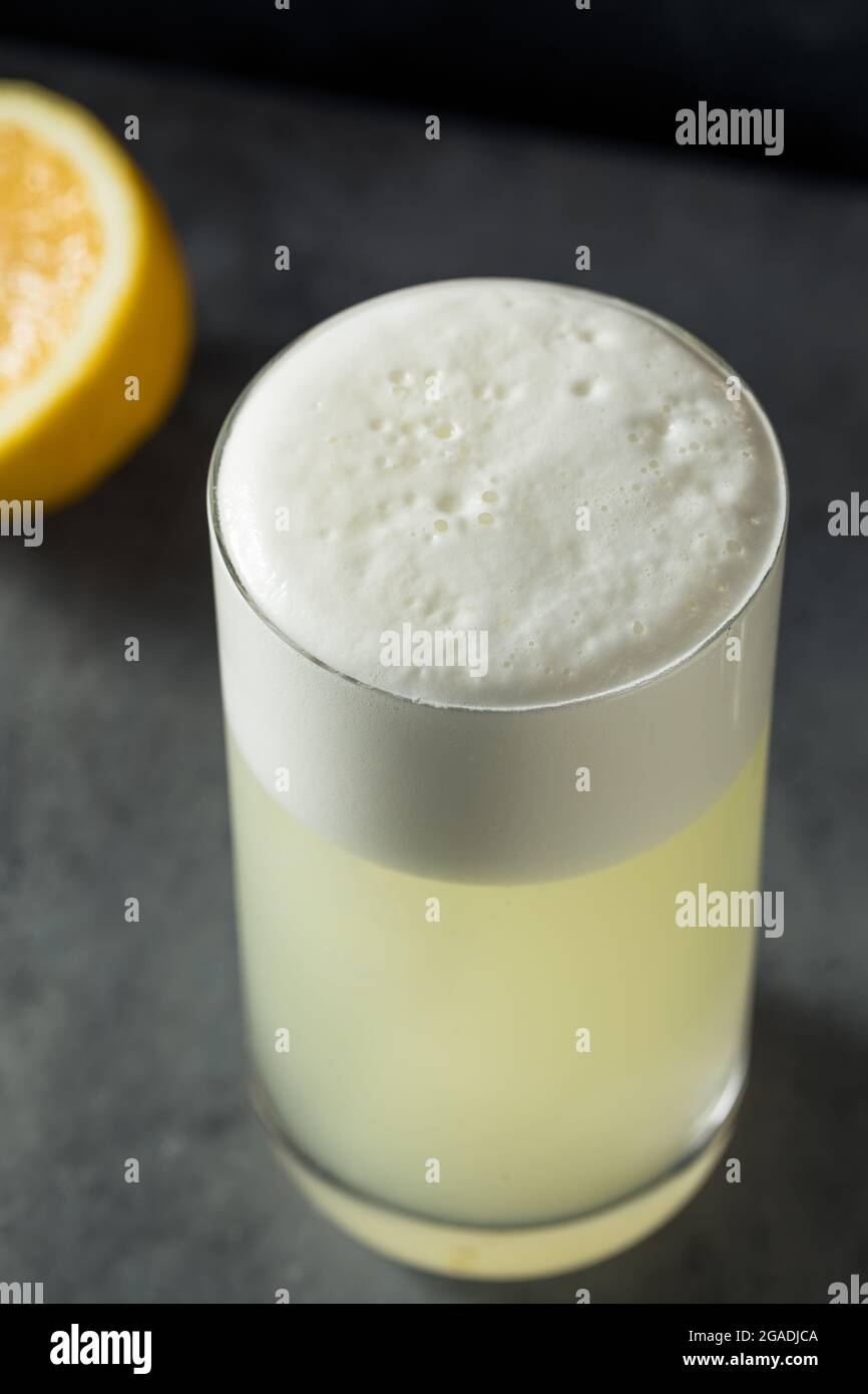 Boozy Refreshing Lemon Gin Fizz with an Egg White Stock Photo Alamy