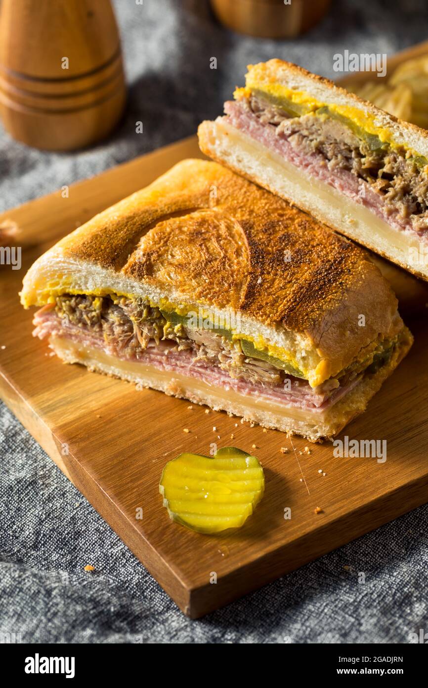 Hearty Homemade Cubano Pork Sandwich with Ham Cheese and Mustard Stock Photo