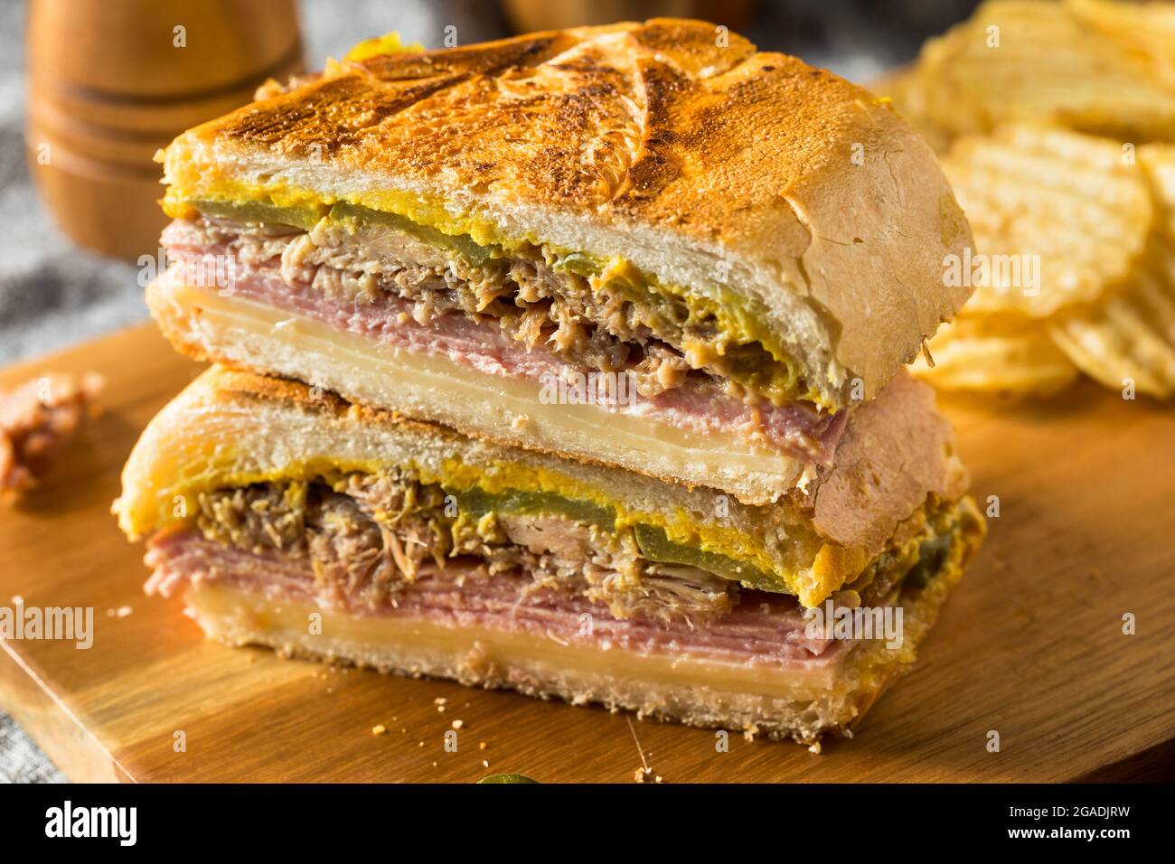 Hearty Homemade Cubano Pork Sandwich with Ham Cheese and Mustard Stock Photo
