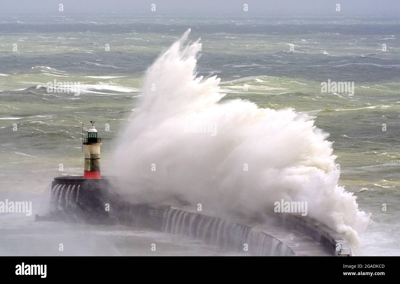 Newhaven, East Sussex, UK. 30th July, 2021. Waves crash over Newhaven's Breakwater as Storm Evert brings rough seas to the south coast. East Sussex. Credit: Peter Cripps/Alamy Live News Stock Photo