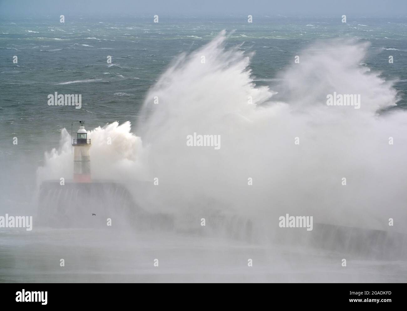 Newhaven, East Sussex, UK. 30th July, 2021. Waves crash over Newhaven's Breakwater as Storm Evert brings rough seas to the south coast. East Sussex. Credit: Peter Cripps/Alamy Live News Stock Photo