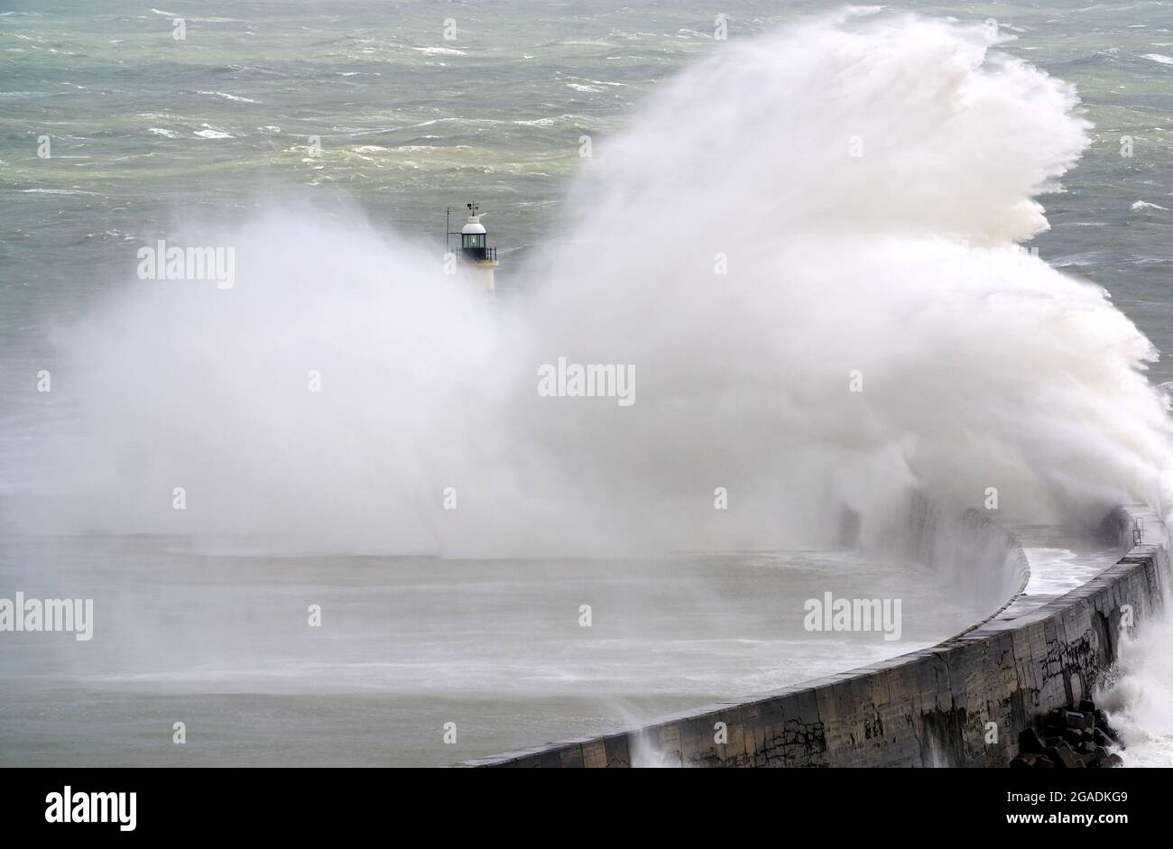 Newhaven, East Sussex, UK. 30th July, 2021. Waves crash over Newhaven's Breakwater as Storm Evert brings rough seas to the south coast. East Sussex. Credit: Peter Cripps/Alamy Live News Stock Photo