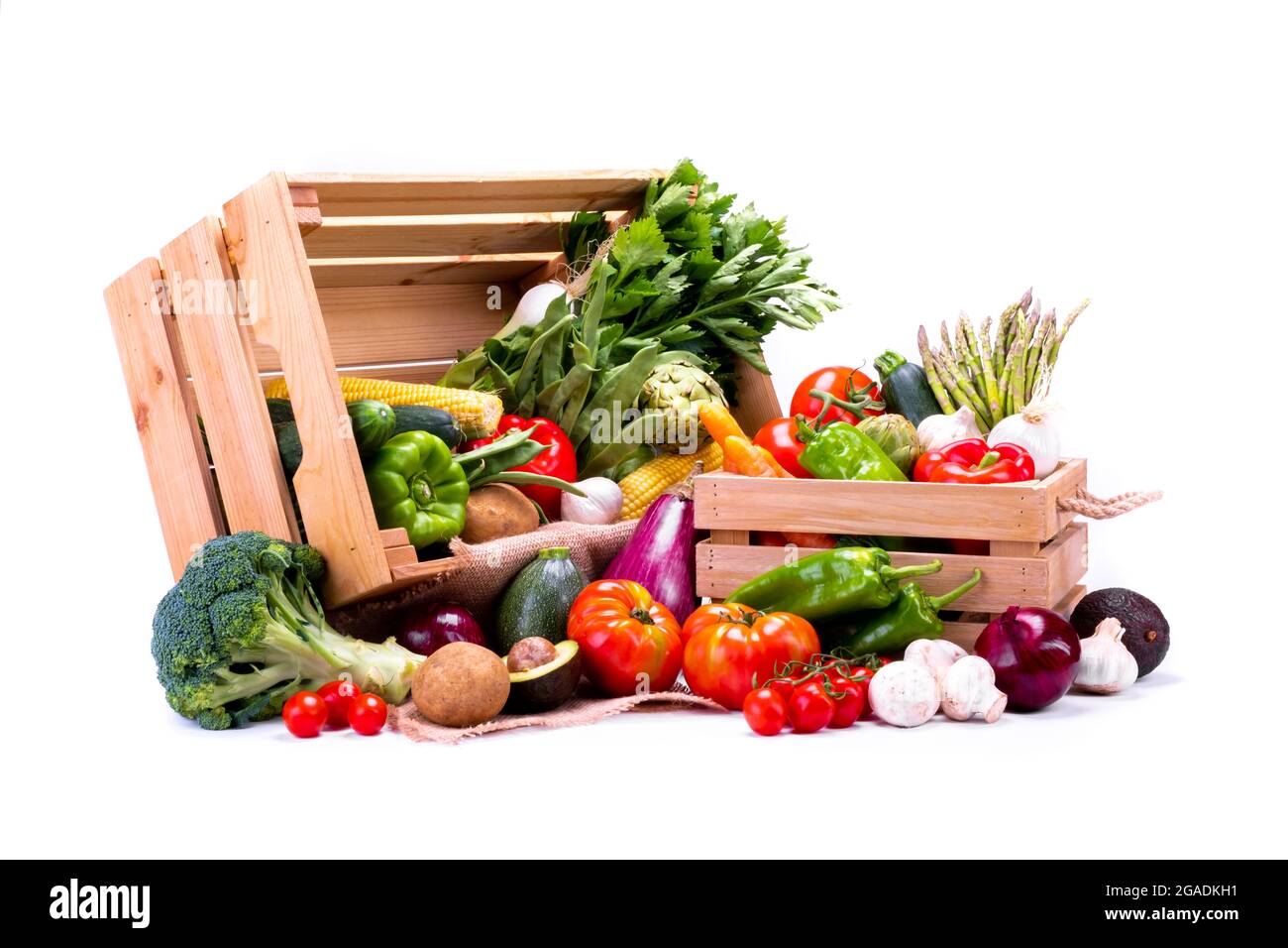 Pine boxes full of fresh vegetables on a white background, ideal for a ...