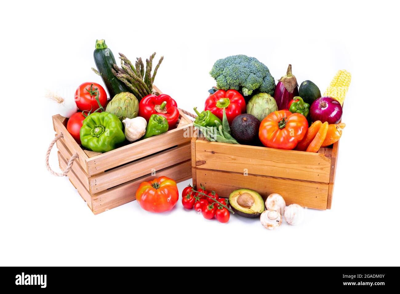 Healthy fresh vegetables in wooden boxes on white background, healthy food Stock Photo