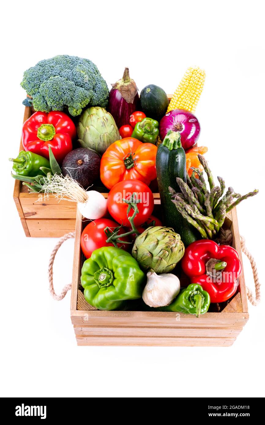 Top view of Healthy fresh vegetables in wooden boxes on white ...
