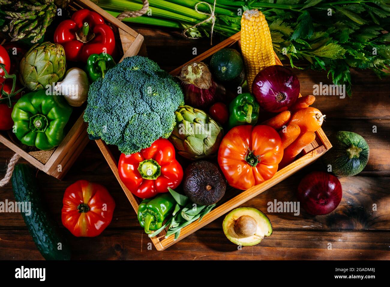Top view of colorful fresh farm vegetables on a wooden table, balanced diet Stock Photo