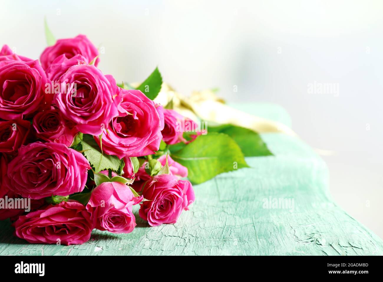 Beautiful roses on bright background Stock Photo - Alamy