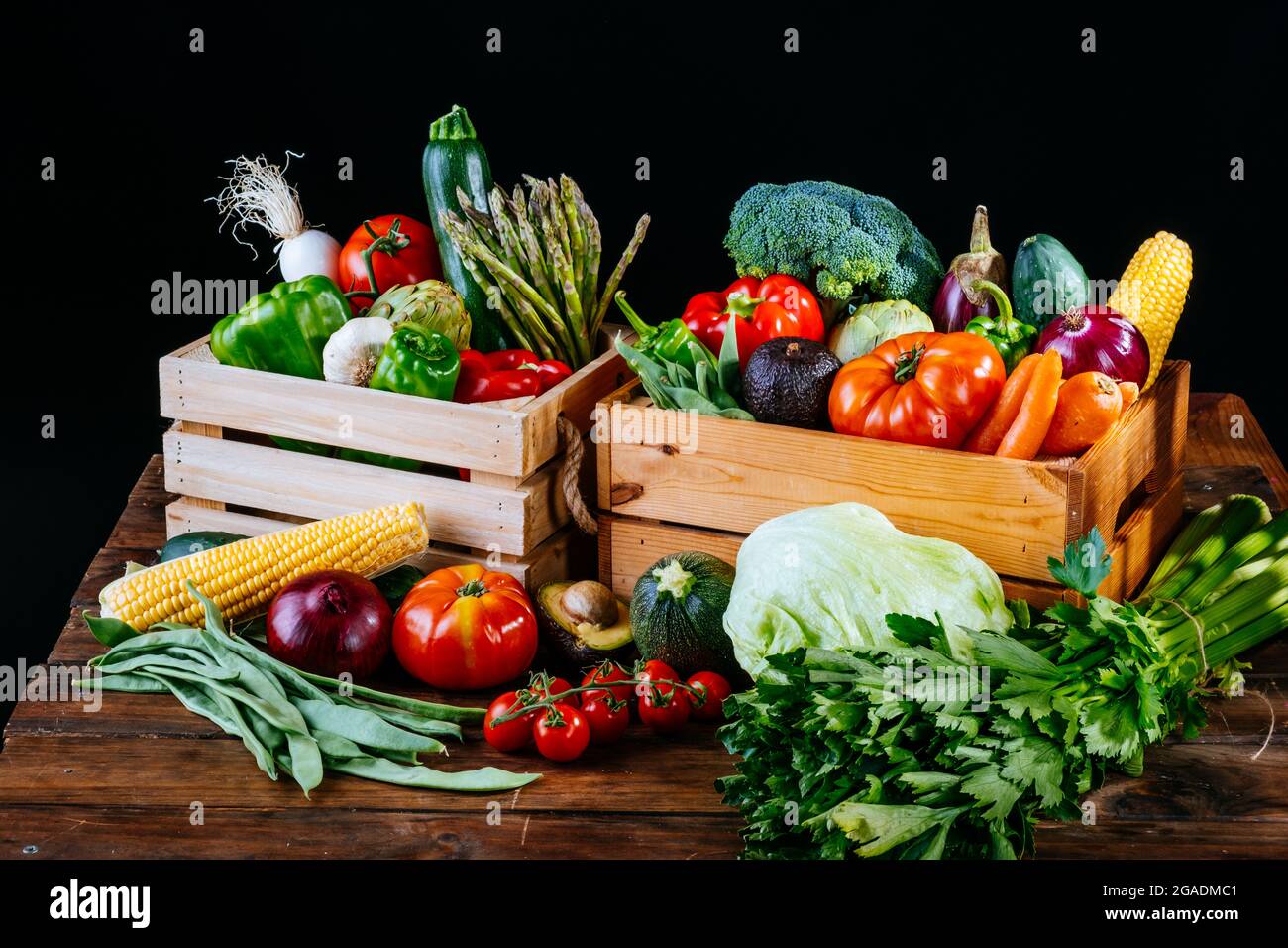 Boxes full of different types of healthy organic vegetables for a vegan diet Stock Photo