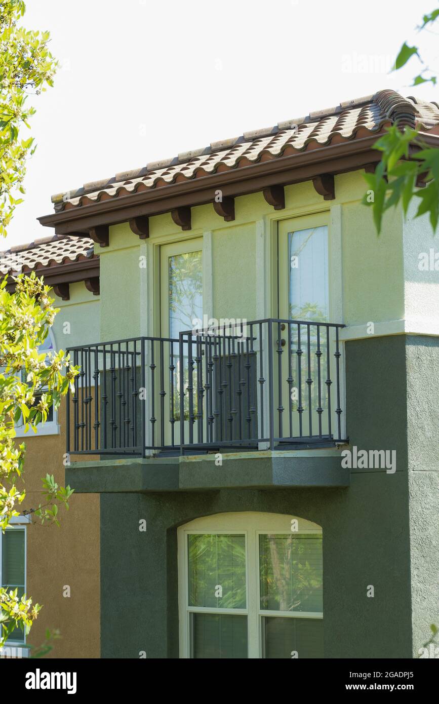 Picture of Vertical shot of a modern designed house with glass windows and balcony ...
