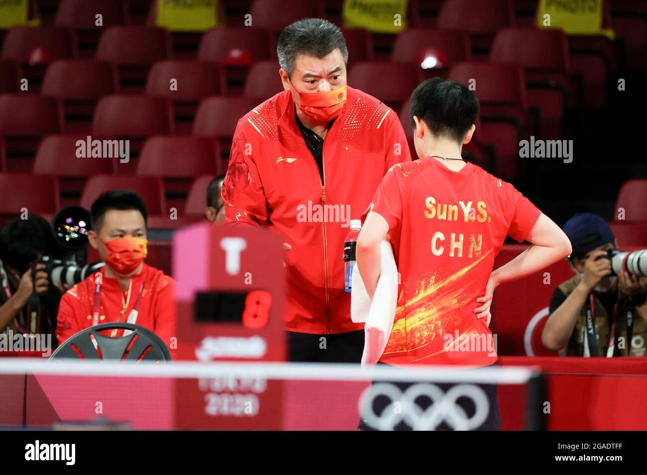 Tokyo, Japan, 29 July, 2021. Yingsha Sun receives instructions from her ...