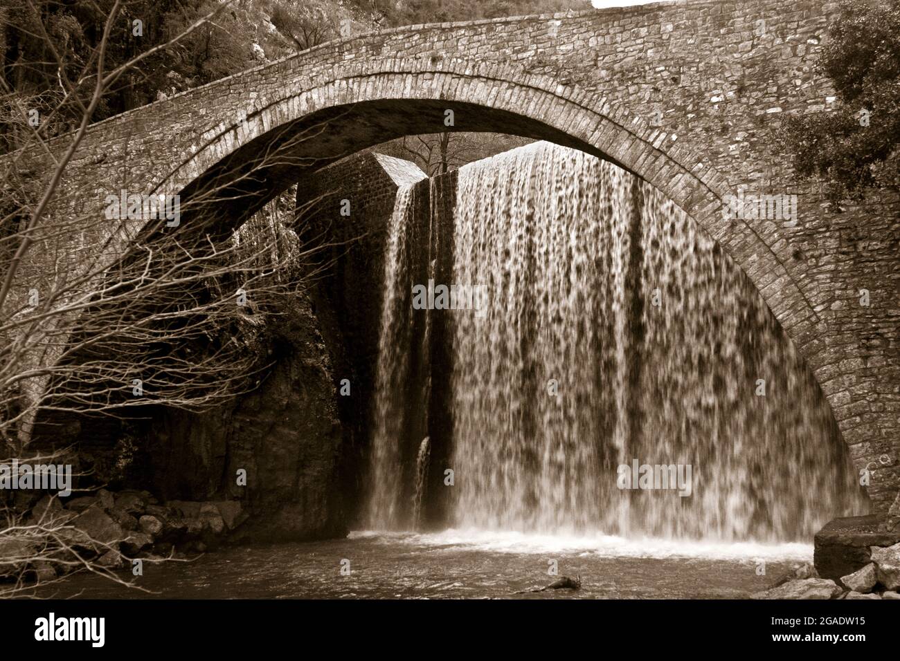 Fine art version of the stone bridge of Paleokaria, in Trikala region, Thessaly, Greece, Europe. Stock Photo