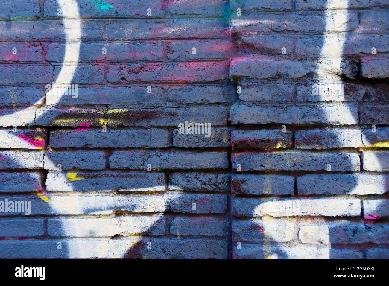 Blue brick wall with white lines painted on. Stock Photo