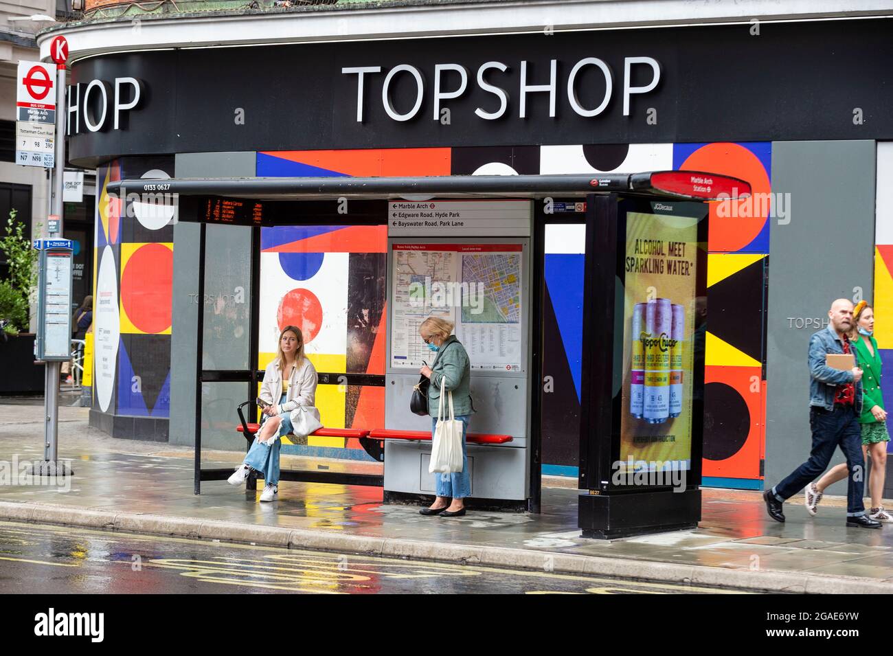 London, UK. 30 July 2021. People outside an empty Topshop store on Oxford  Street. According to a report from the British Retail Consortium (BRC) and  Local Data Company, one in seven shops