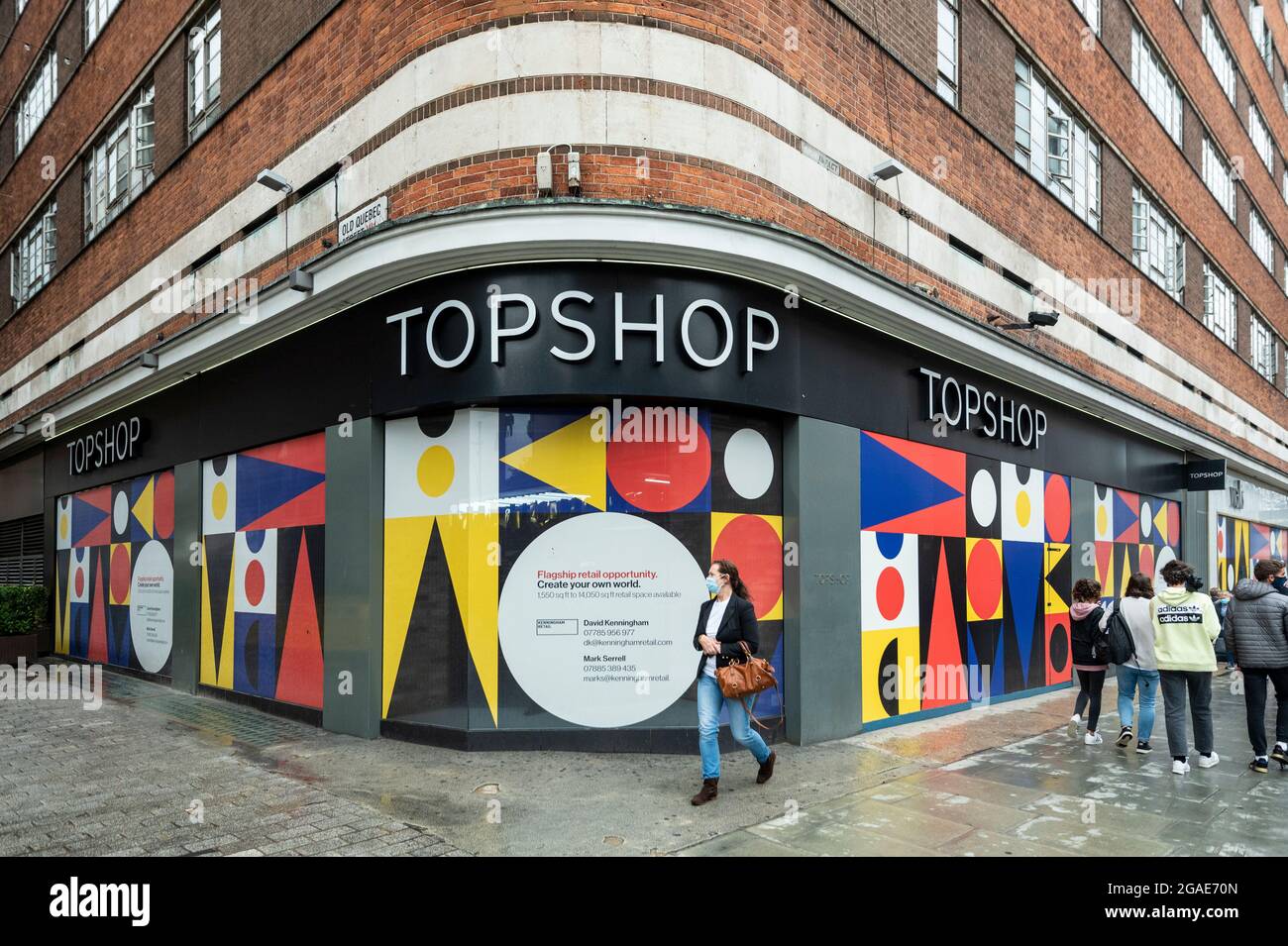 London, UK. 30 July 2021. People pass an empty Topshop store on Oxford  Street. According to a report from the British Retail Consortium (BRC) and  Local Data Company, one in seven shops