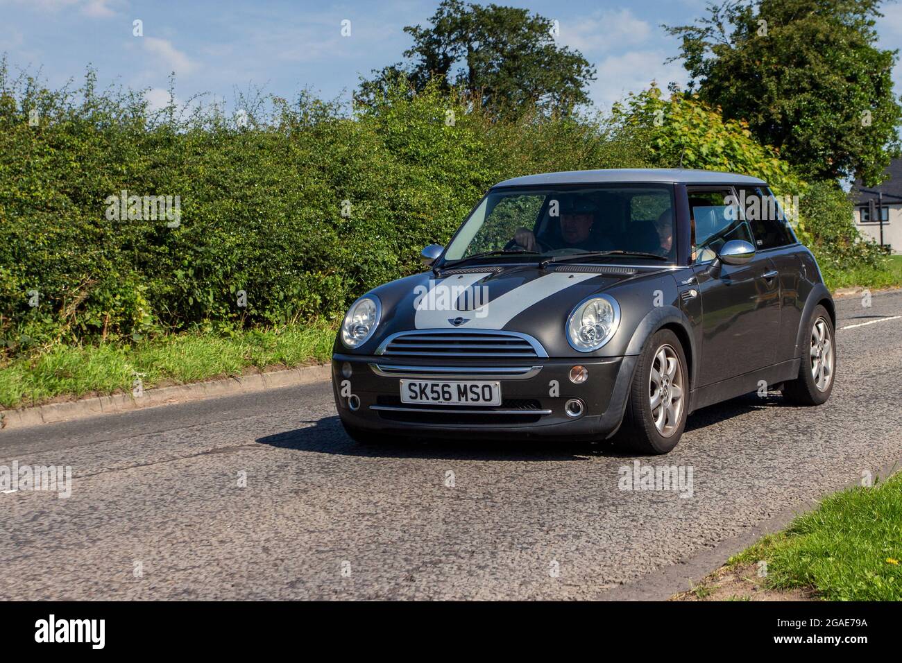 2006 grey British Mini Cooper Park Lane 1598cc petrol hatchback en-route to Capesthorne Hall classic July car show, Cheshire, UK Stock Photo