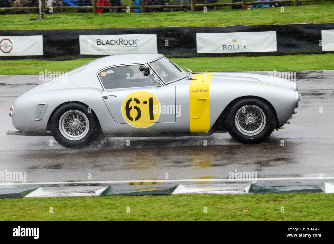 Ferrari 250 GT SWB Berlinetta racing car competing in the RAC Tourist Trophy Celebration endurance race at the Goodwood Revival 2013 in wet conditions Stock Photo