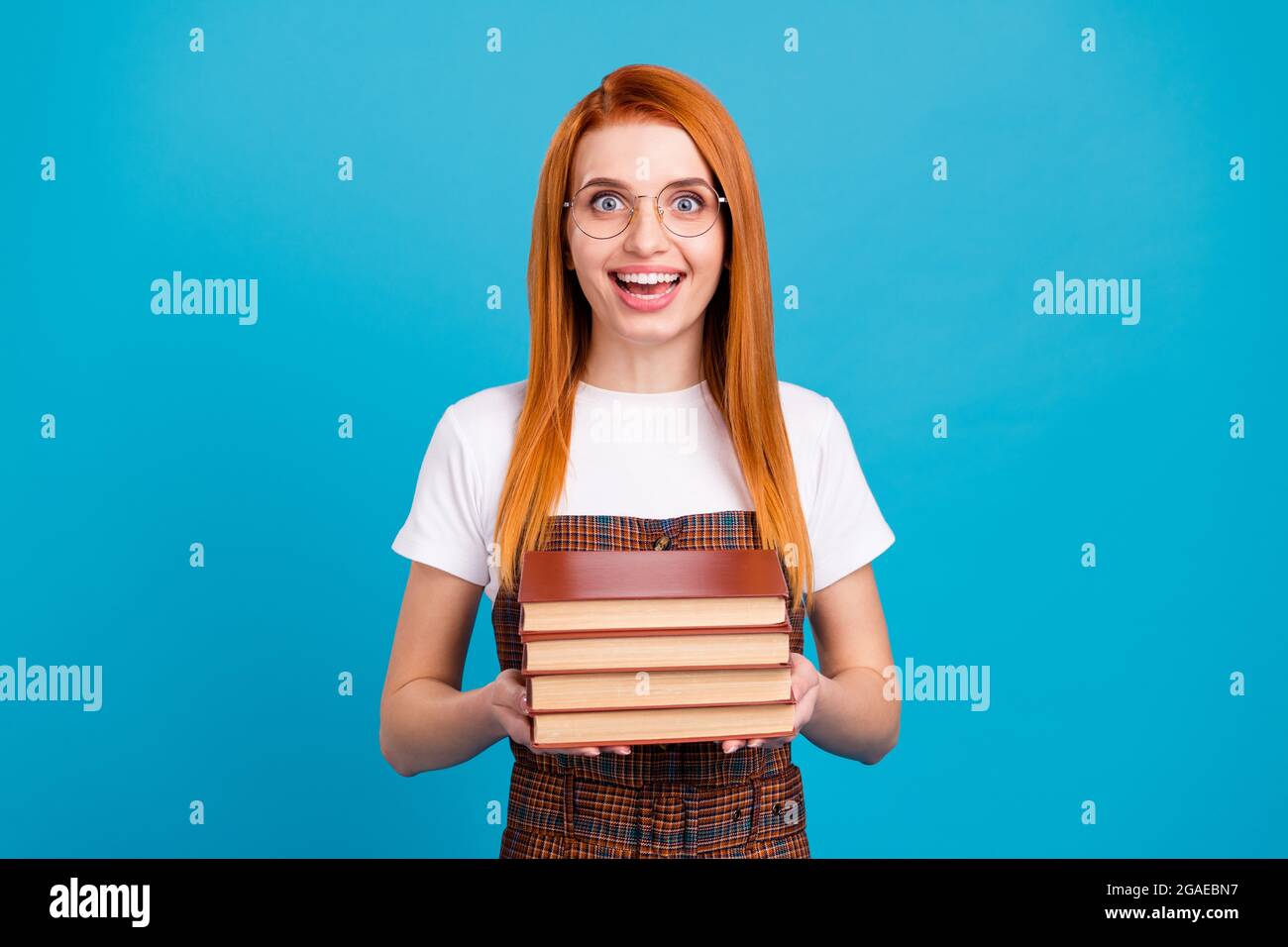 Photo of young excited girl happy positive smile hold book study ...