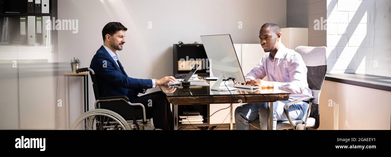 African American Handicapped Man Employee. People In Wheel Chair Stock Photo