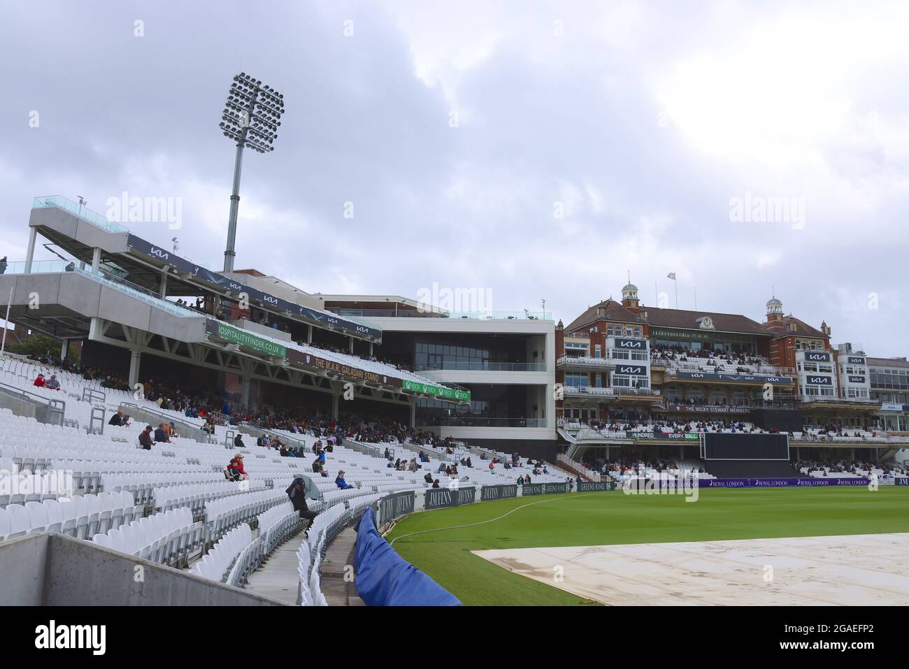 London, UK. 30th July, 2021. 30 July, 2021. London, UK. The newly opened  M.A.R. Galadari Stand next to the Micky Stewart Members’ Pavilion as rain delays the start of play as Surrey take on Northamptonshire in the Royal London One-day Cup at the Kia Oval. David Rowe/ Alamy Live News Credit: David Rowe/Alamy Live News Stock Photo
