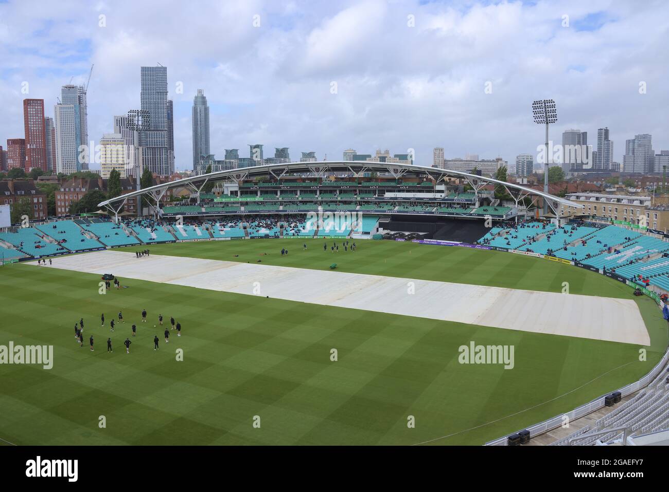 London, UK. 30th July, 2021. 30 July, 2021. London, UK. The newly named JM Finn stand as rain delays the start of play as Surrey take on Northamptonshire in the Royal London One-day Cup at the Kia Oval. David Rowe/ Alamy Live News Credit: David Rowe/Alamy Live News Stock Photo