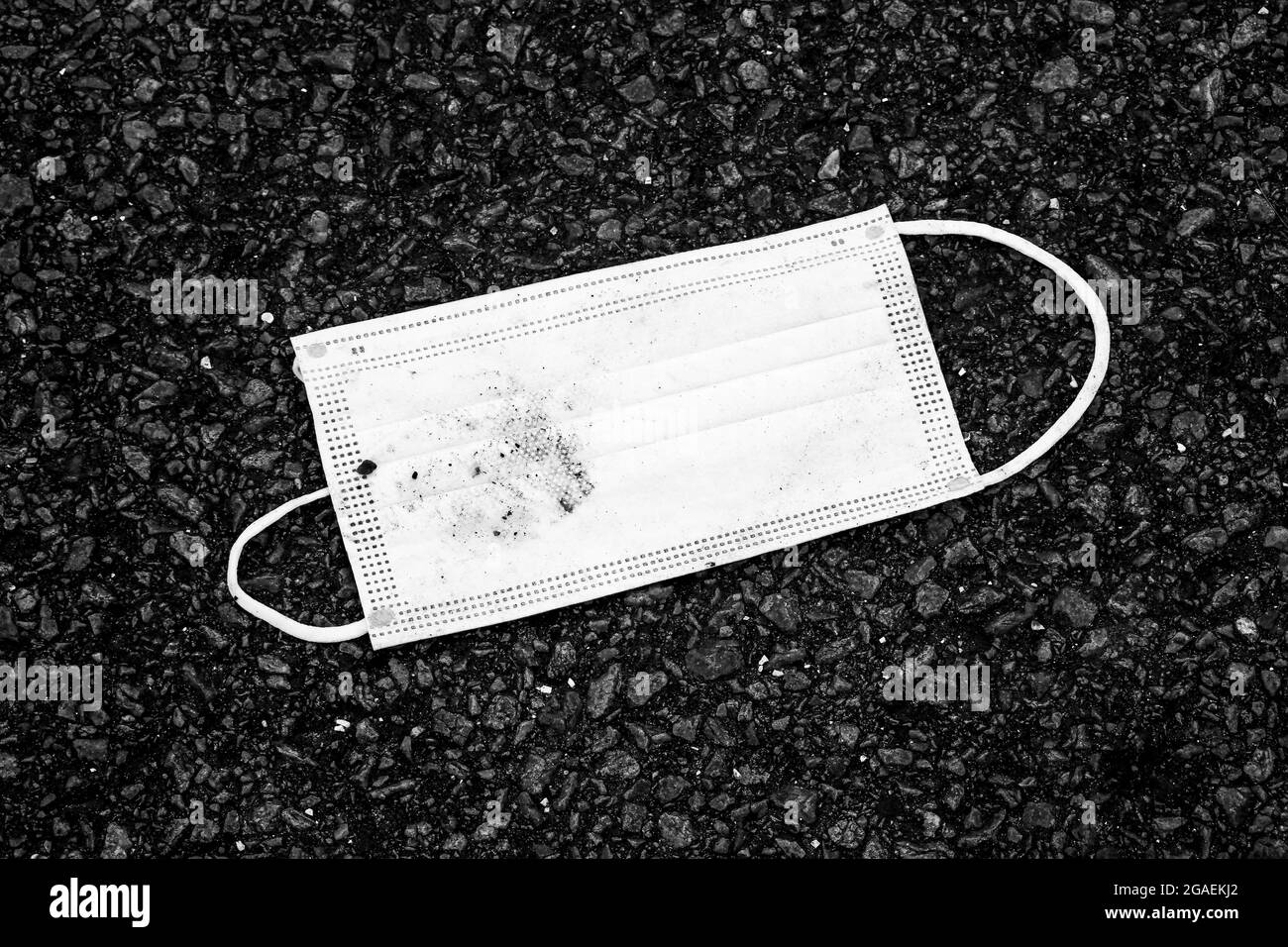 Abandonned face mask, B&W view, Rest area, A10 highway to Normandy, France Stock Photo