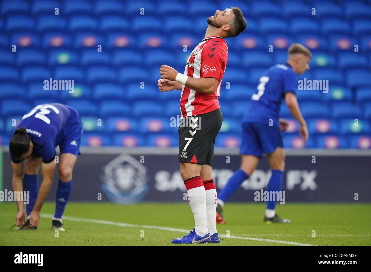 Southampton's Shane Long shows his frustration after missing chance to score during the preseason friendly match at the Cardiff City Stadium. Picture date: Tuesday July 27, 2021. Stock Photo