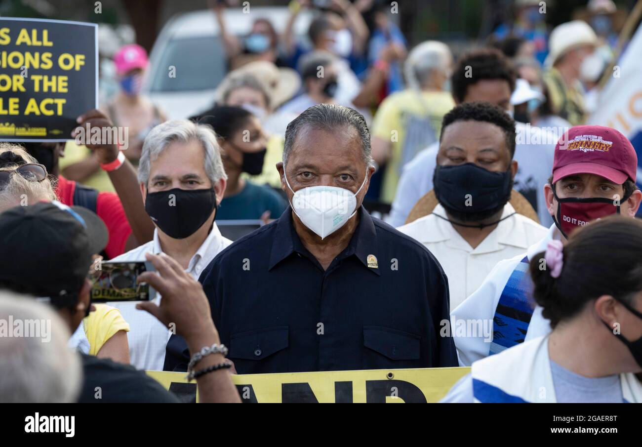 Austin, Texas USA, July 30, 2021: Civil rights activist JESSE JACKSON (in black) joins voting rights groups  as they march toward the Texas Capitol from north Austin on the third day of a 30-mile journey protesting Republican efforts to suppress votes nationwide and in Texas. Credit: Bob Daemmrich/Alamy Live News Stock Photo