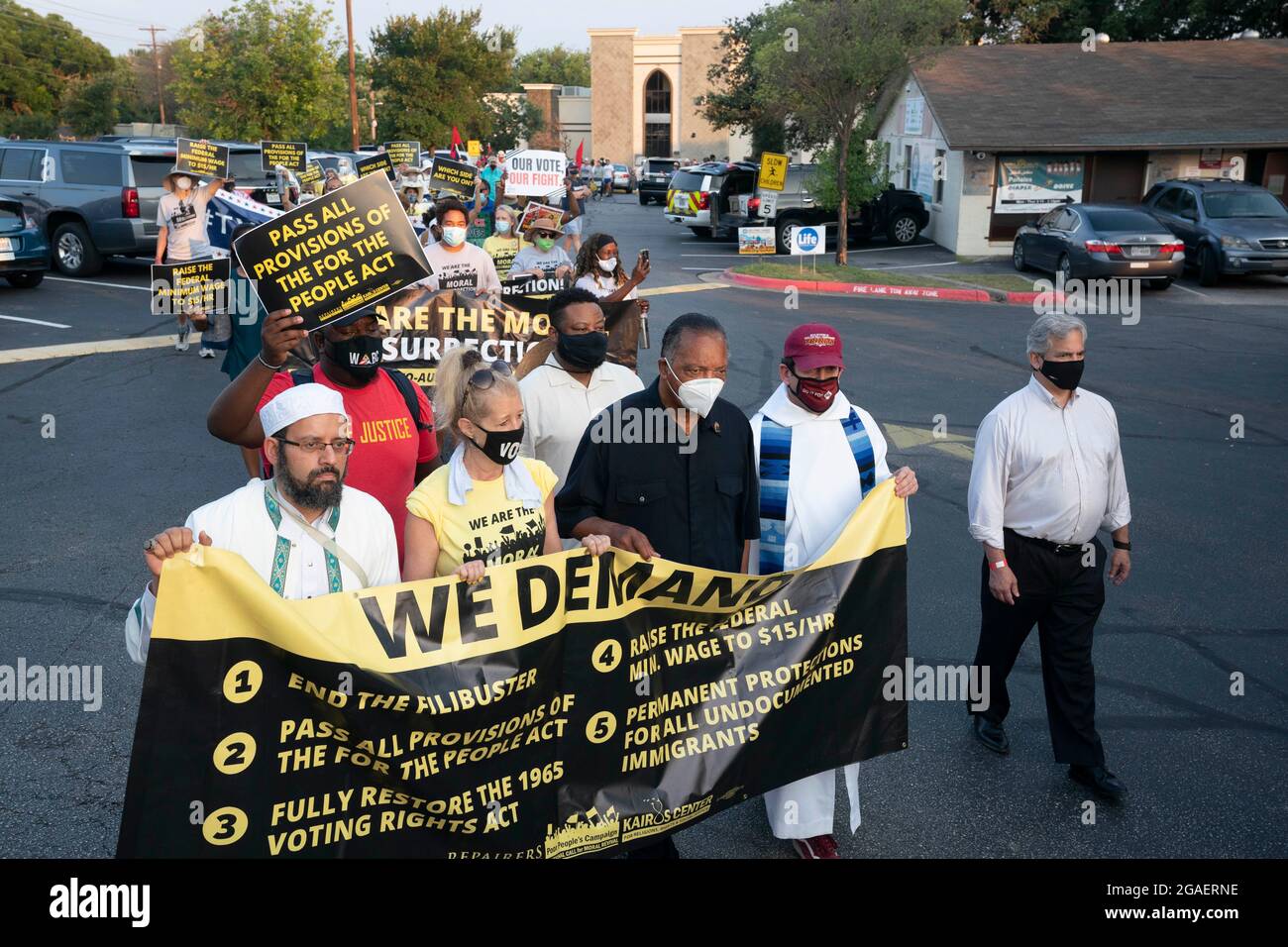 Austin, Texas USA, July 30, 2021: Faith leaders headed by legendary civil rights activist JESSE JACKSON (in black) as voting rights groups march toward the Texas Capitol from north Austin on the third day of a 30-mile journey protesting Republican efforts to suppress votes nationwide and in Texas. Credit: Bob Daemmrich/Alamy Live News Stock Photo