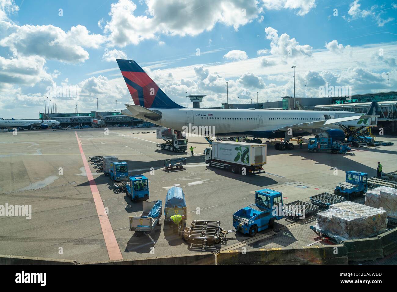 Amsterdam, the Netherlands - July 29, 2021: Aircraft by Delta Airline seen at Shiphol airport. Fully vaccinated travelers are allowed to travel during pandemic but required to wear masks at airports and while on aircrafts. Stock Photo