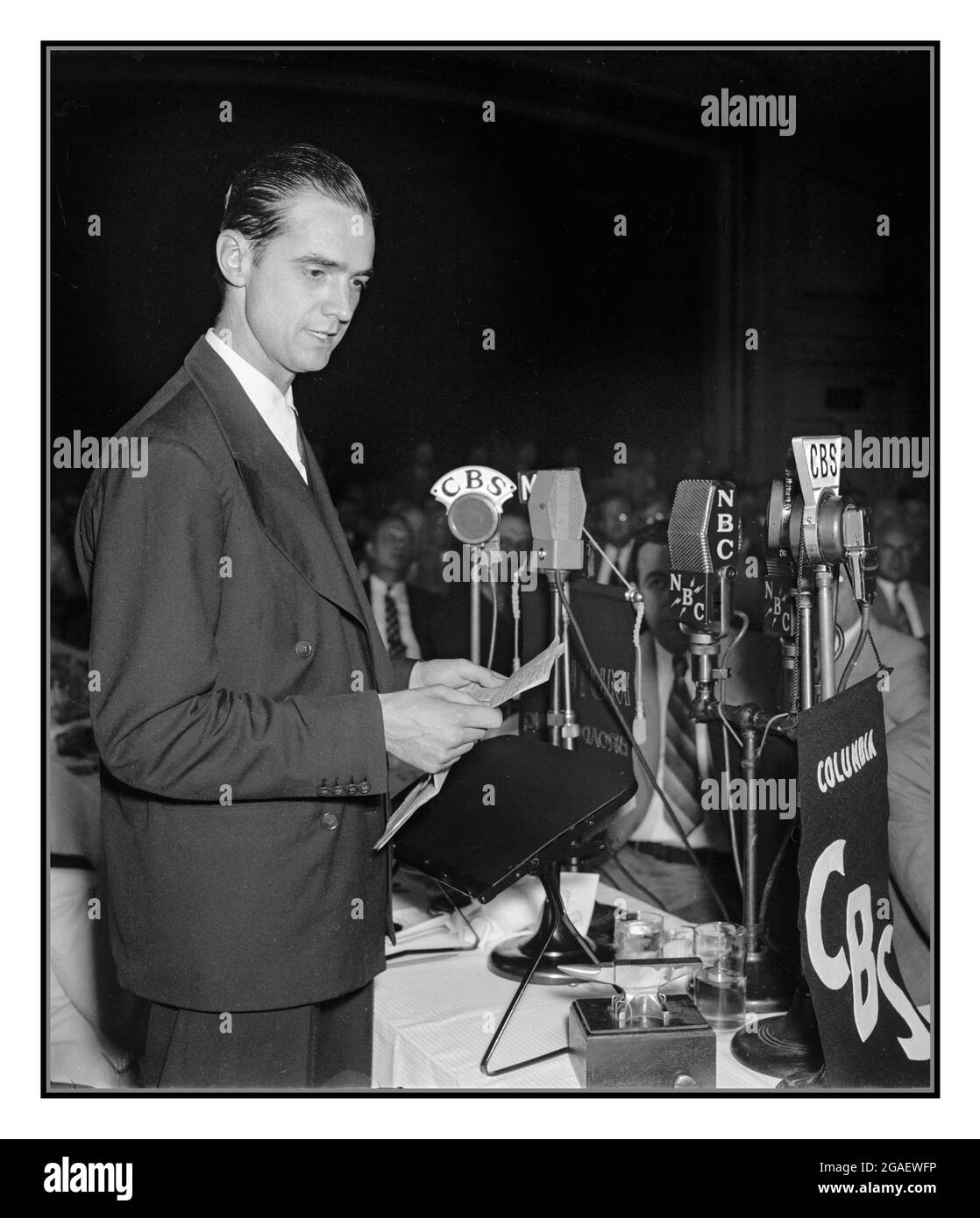 Howard Hughes 7/21/38 speaking before the Press Club. Washington, D.C., July 21. Howard Hughes, speaking at the National Press Club today, before government officials and representatives of foreign governments. Hughes today envisioned a future in aviation when giant flying boats, almost as large as modern ocean liners, will fly the Atlantic  speaking at the luncheon in his honor, he described in detail the type of flying craft and equipment he believes the future will see but which is now nothing more than an aeronautical engineers dream Stock Photo