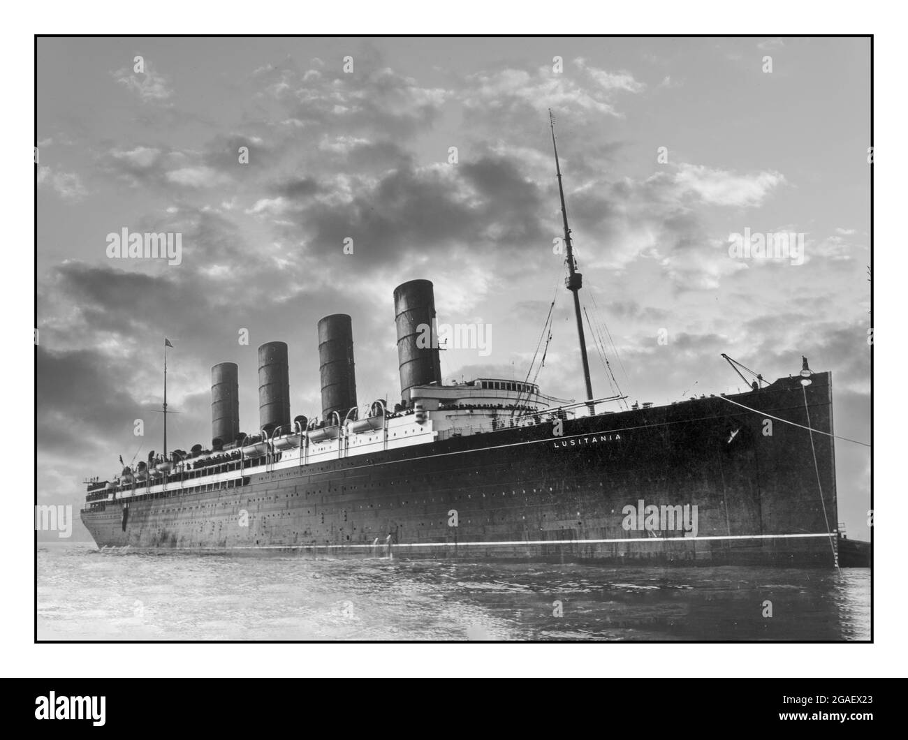 R.M.S. Lusitania coming into port, possibly in New York. RMS Lusitania was a British ocean liner that was sunk on 7 May 1915 by a German U-boat 11 miles (18 km) off the southern coast of Ireland, killing 1,198 passengers and crew. The sinking occurred about two years before the United States declaration of war on Germany. Although the Lusitania sinking was a major factor in building support for a war, war was eventually declared only after the Imperial German Government resumed the use of unrestricted submarine warfare against American shipping. Stock Photo