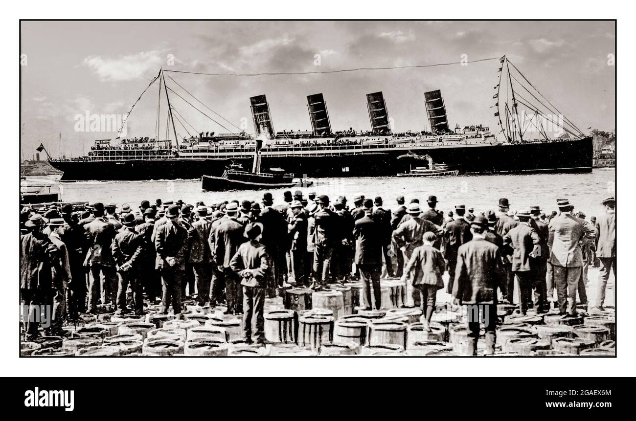 RMS Lusitania, New York City, September 1907, stern-side view,during maiden voyage, with a large crowd of men, in foreground, standing on top of barrels Date Created/Published: 1907. The RMS Lusitania was a UK-registered ocean liner that was torpedoed by an Imperial German Navy U-boat during the First World War on 7 May 1915, about 11 miles off the Old Head of Kinsale, Ireland.with 1,198 people who lost their lives in this atrocity Stock Photo