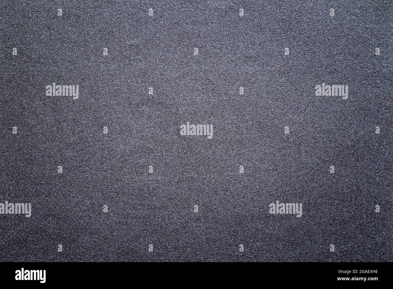 Sandpaper texture background gives a beautiful pattern of black sand