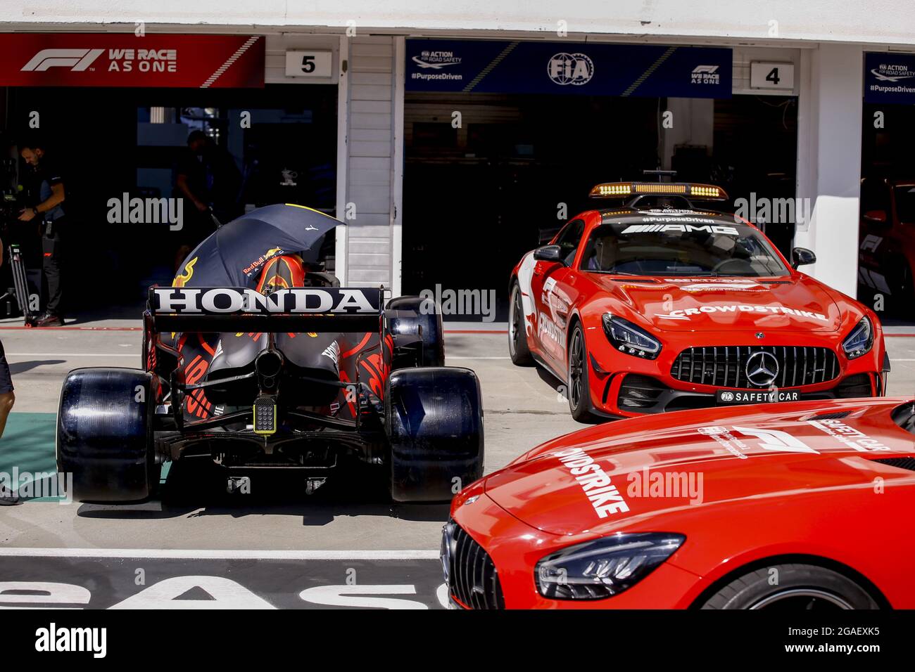 Red Bull Racing Honda RB16B, and safety car, during the Formula 1 Magyar Nagydij 2021, Hungarian Grand Prix, 11th round of the 2021 FIA Formula One World Championship from July 30 to