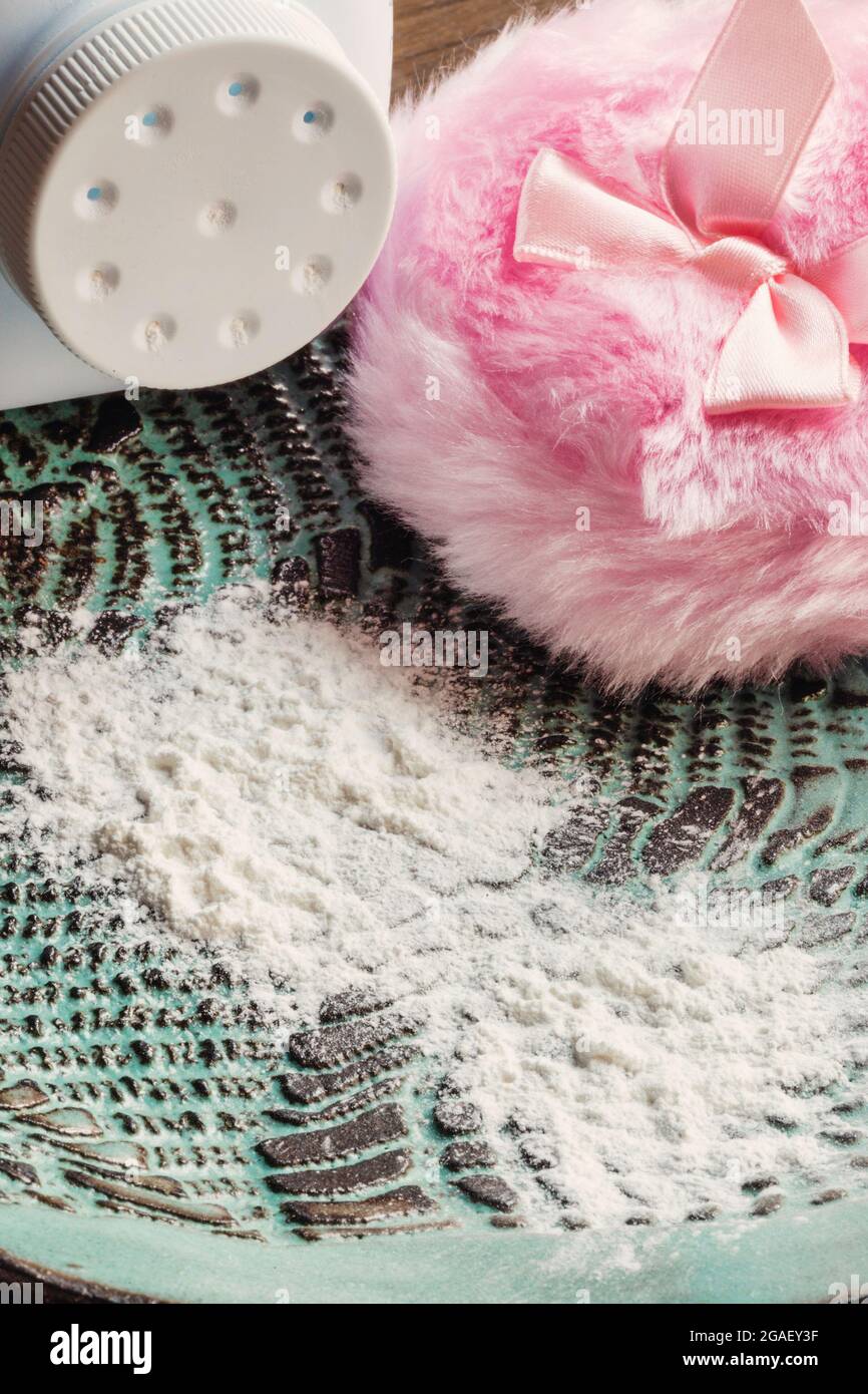 Baby powder container and pink powder puff closeup Stock Photo Alamy