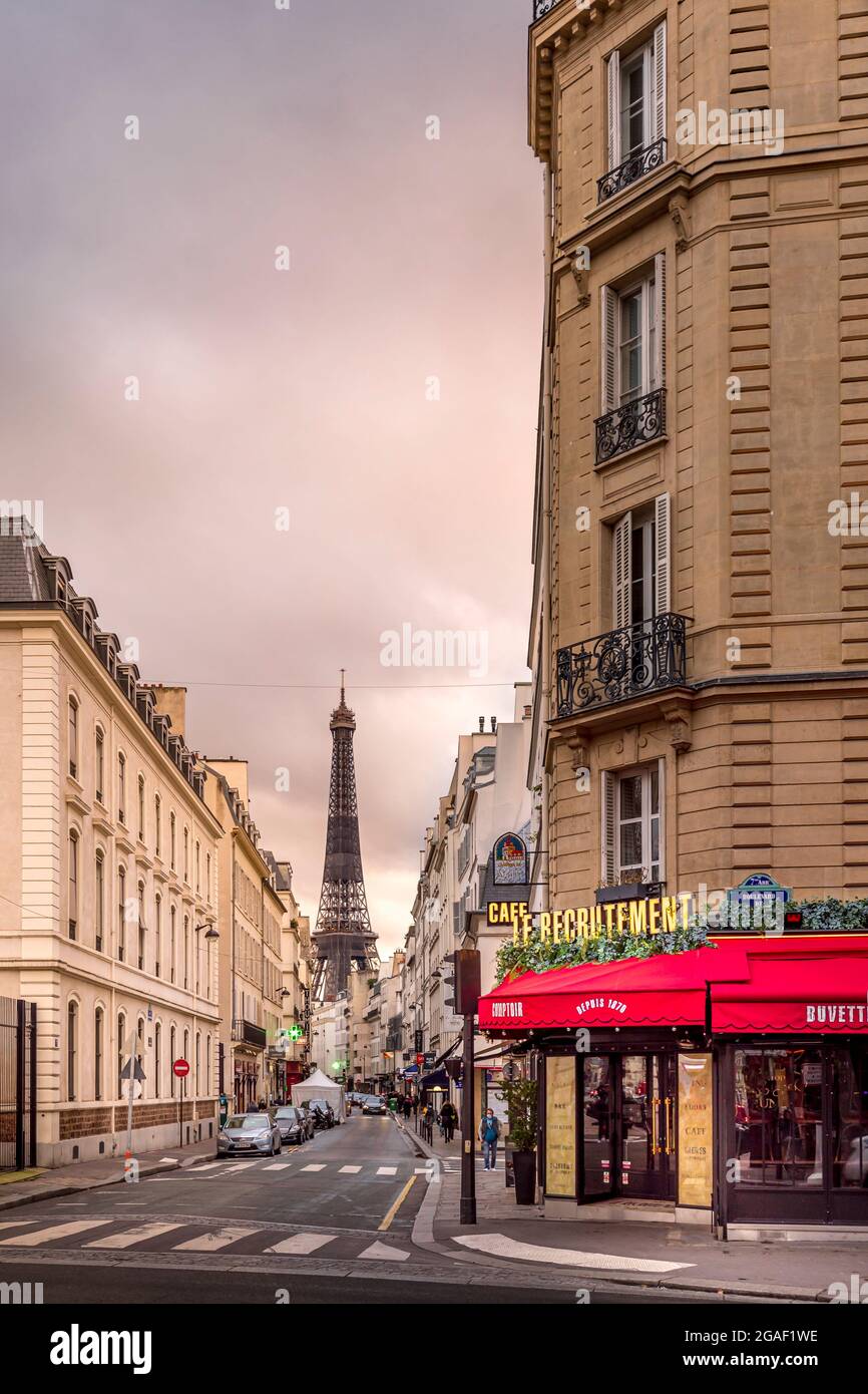 Paris, France - January 28, 2021: Iconic Eiffel tower viewed from a parisian street in Paris Stock Photo