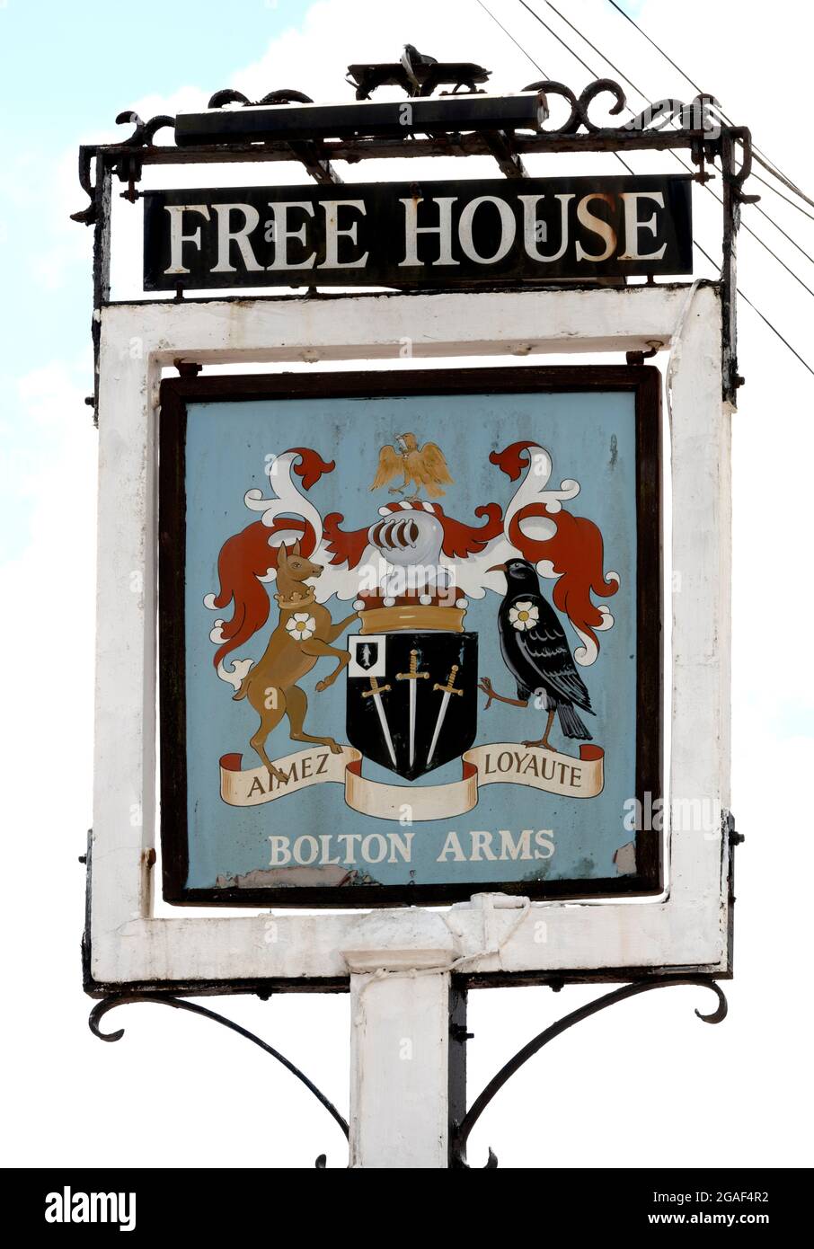 Traditional hanging pub sign at The Bolton Arms public house, Old Basing, Basingstoke, Hampshire, England, UK Stock Photo