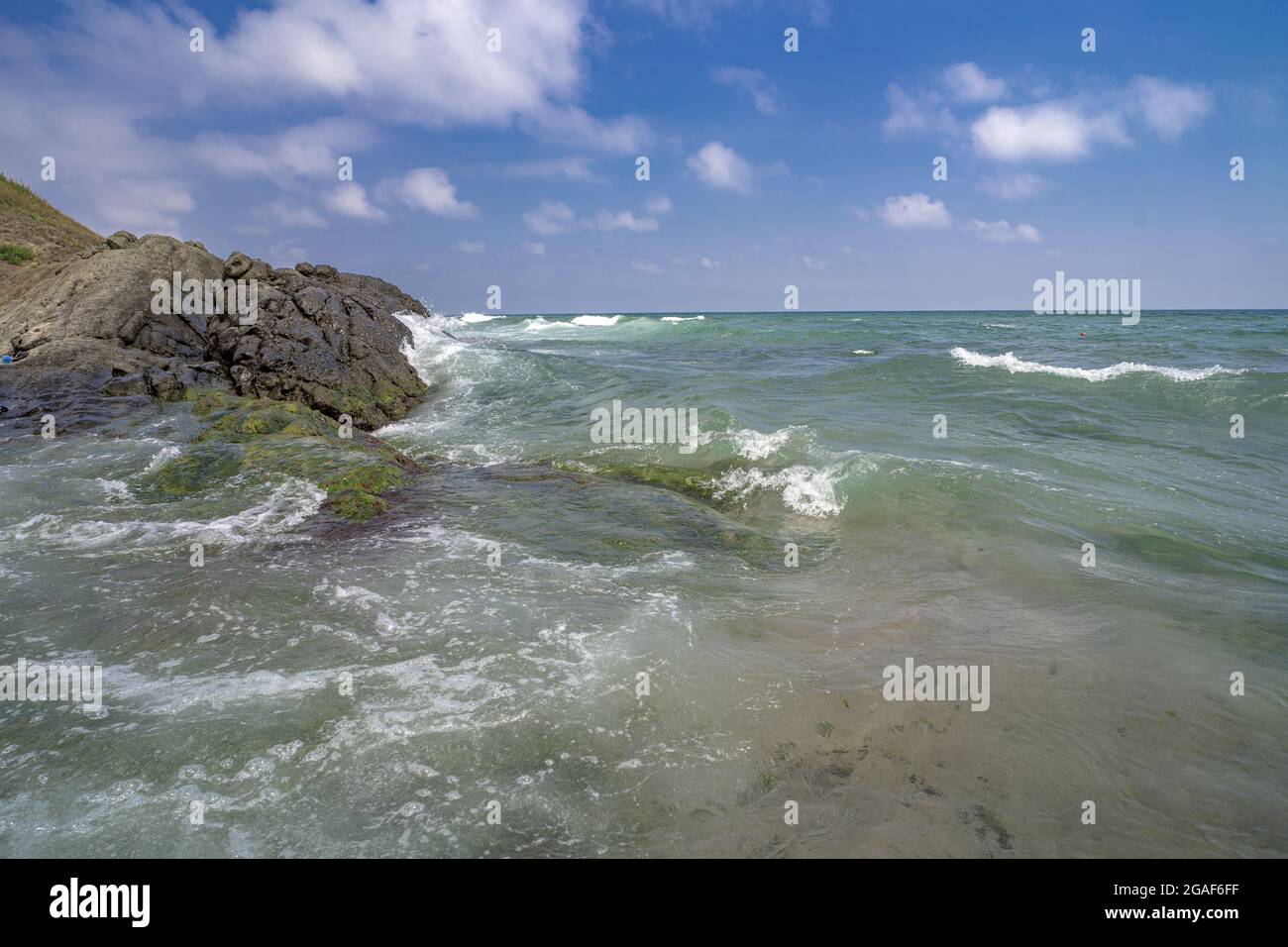 Beautiful view of waves splashing on the seashore Stock Photo - Alamy
