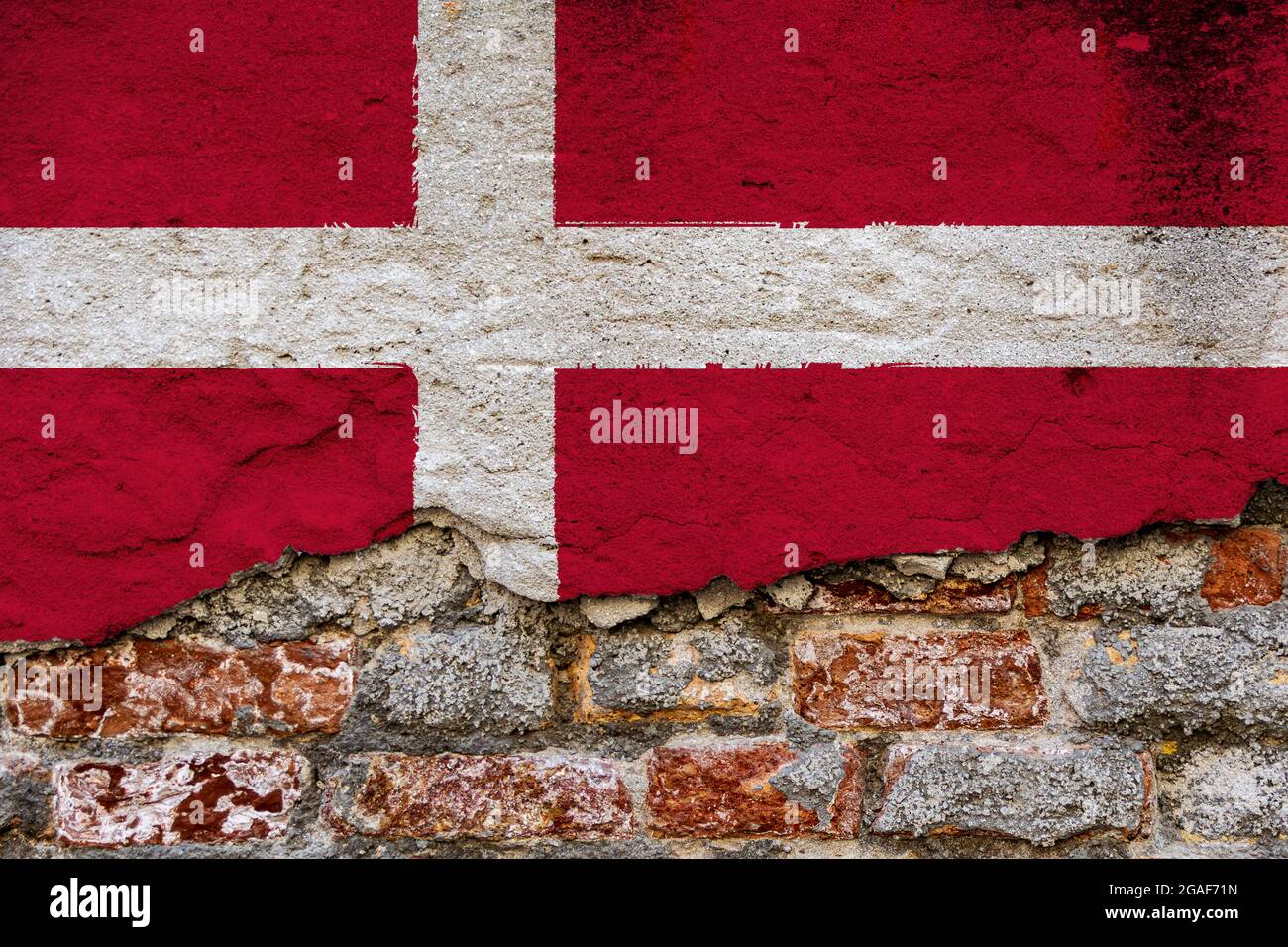 Graphic Concept with a Flag of Denmark painted on a damaged brick wall ...