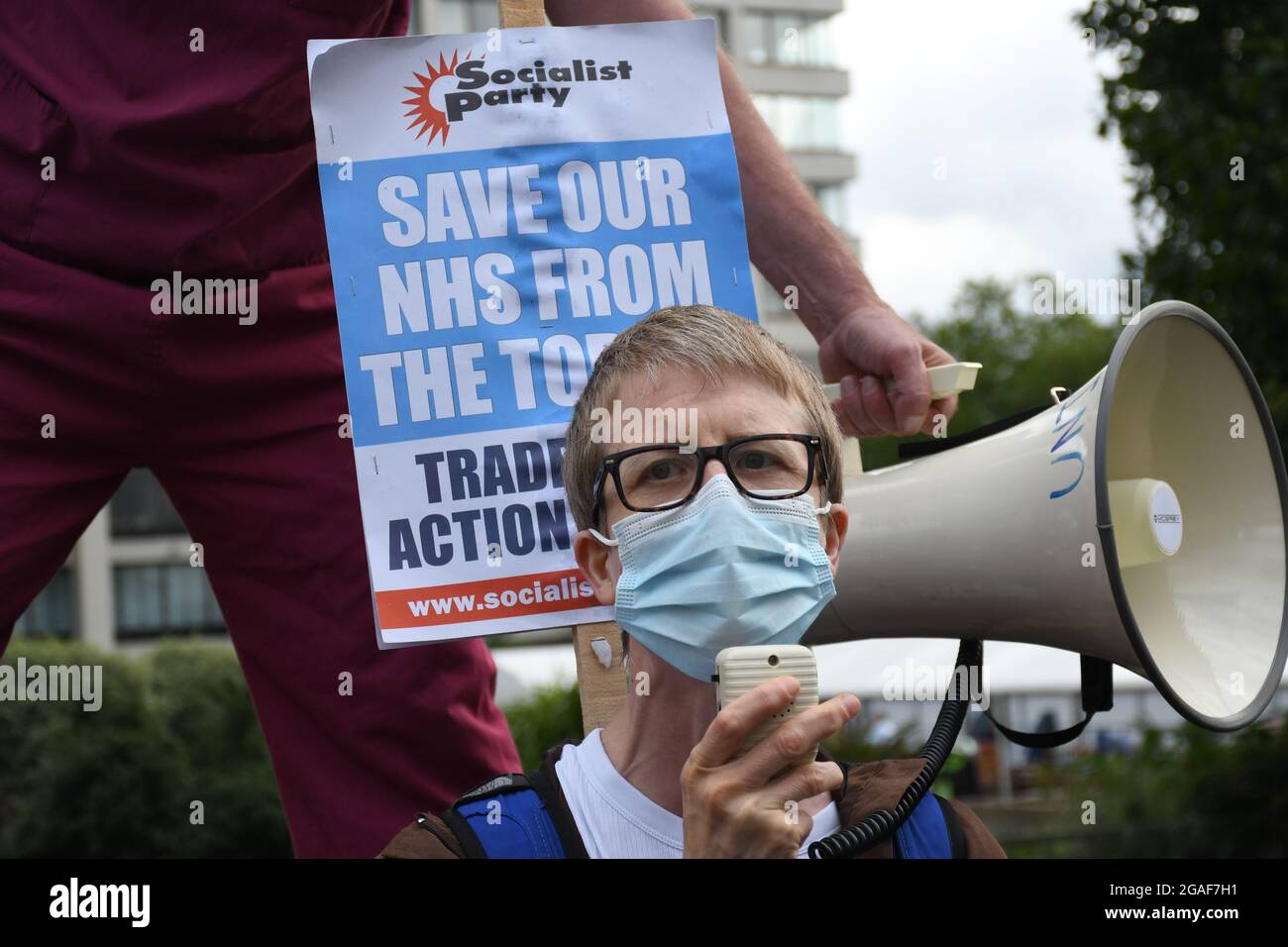 London, UK. 30th July, 2021. Doctors and nurses assembly at St Thomas' hospital for a march to Downing St demanding a proper pay rise for NHS workers, protest against the insulting 3% pay increase to NHS staff on 30 July 2021, London, UK. Credit: Picture Capital/Alamy Live News Stock Photo