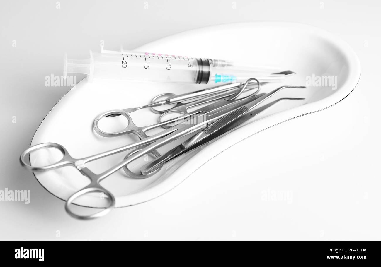 Medical equipment in a bowl isolated on white Stock Photo Alamy