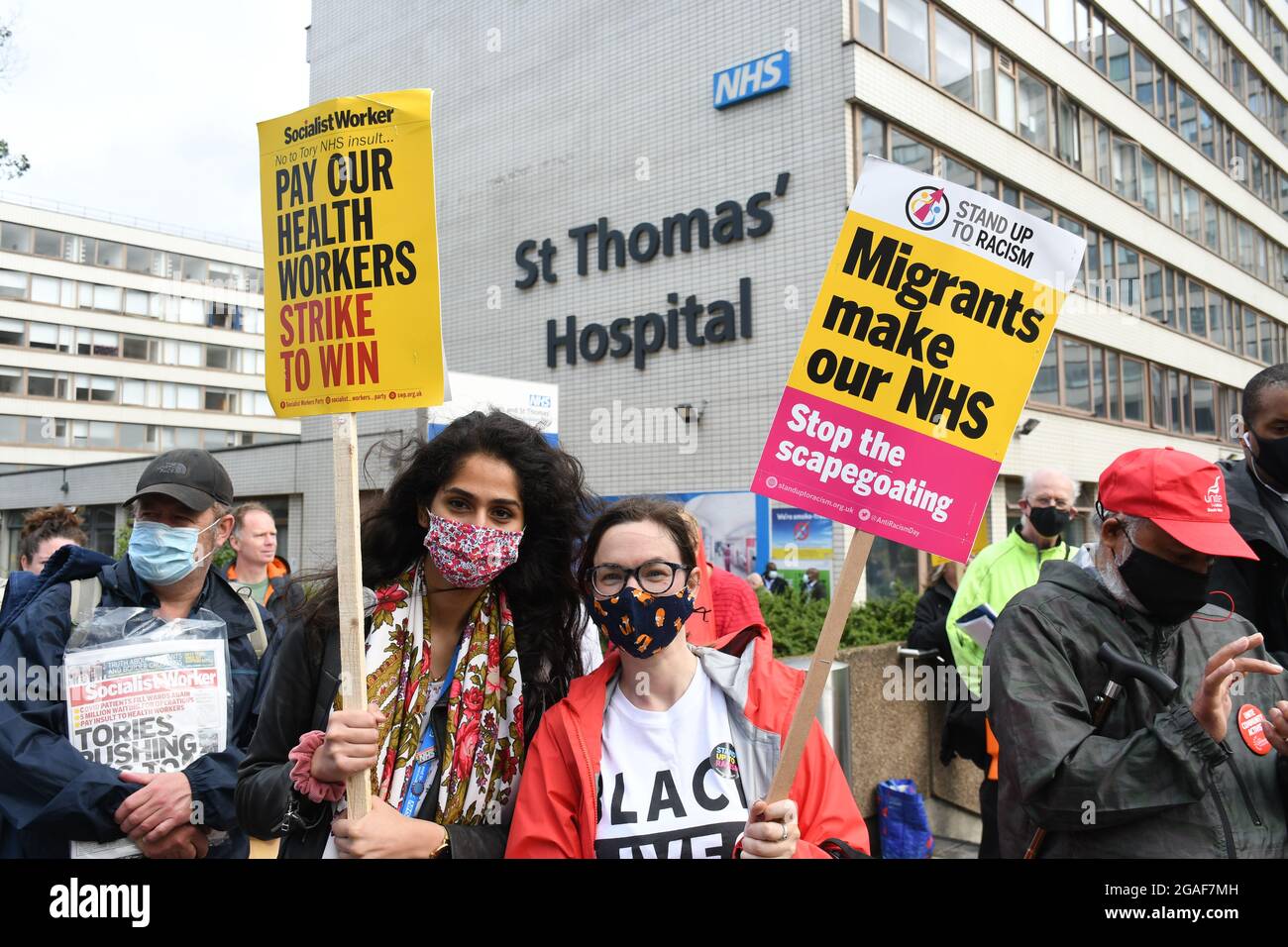 London, UK. 30th July, 2021. Doctors and nurses assembly at St Thomas' hospital for a march to Downing St demanding a proper pay rise for NHS workers, protest against the insulting 3% pay increase to NHS staff on 30 July 2021, London, UK. Credit: Picture Capital/Alamy Live News Stock Photo