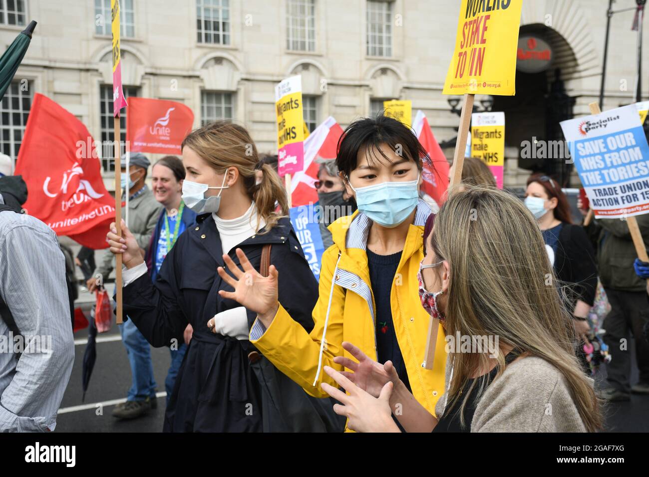 London, UK. 30th July, 2021. Doctors and nurses assembly at St Thomas' hospital for a march to Downing St demanding a proper pay rise for NHS workers, protest against the insulting 3% pay increase to NHS staff on 30 July 2021, London, UK. Credit: Picture Capital/Alamy Live News Stock Photo