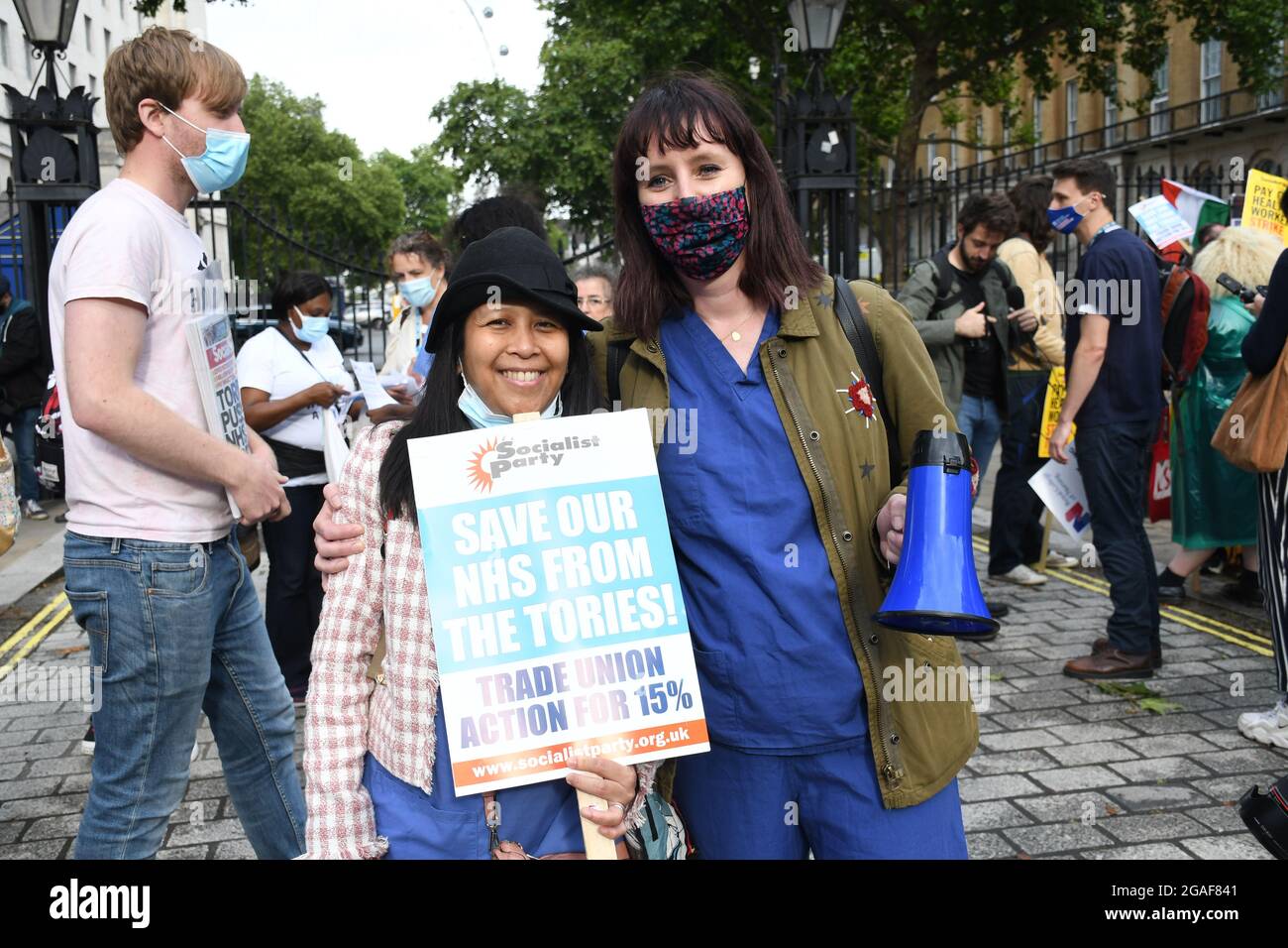 London, UK. 30th July, 2021. Doctors and nurses assembly at St Thomas' hospital for a march to Downing St demanding a proper pay rise for NHS workers, protest against the insulting 3% pay increase to NHS staff on 30 July 2021, London, UK. Credit: Picture Capital/Alamy Live News Stock Photo