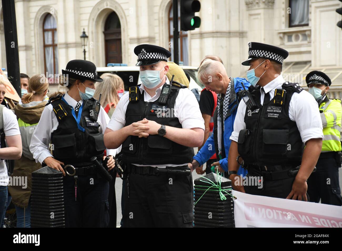 London, UK. 30th July, 2021. Doctors and nurses assembly at St Thomas' hospital for a march to Downing St demanding a proper pay rise for NHS workers, protest against the insulting 3% pay increase to NHS staff on 30 July 2021, London, UK. Credit: Picture Capital/Alamy Live News Stock Photo