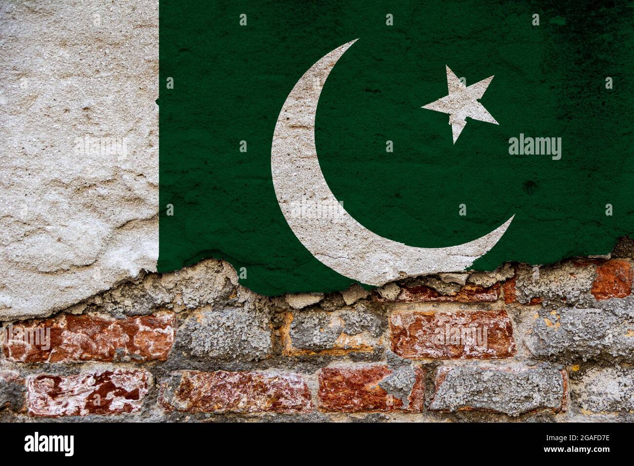 Graphic Concept with a Flag of Pakistan painted on a damaged brick wall ...