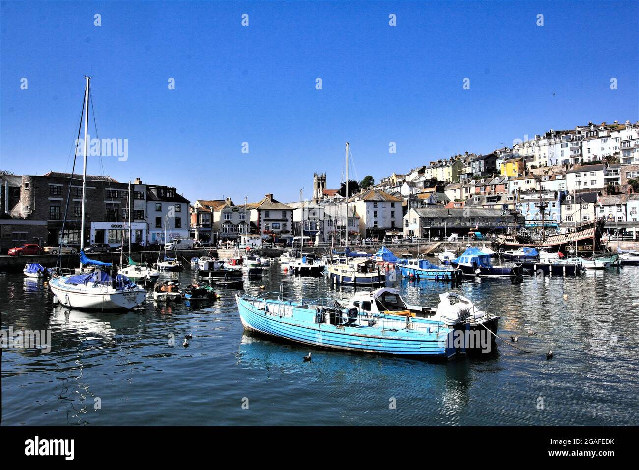 Brixham harbour full of small moored boat's apart from the replica ship